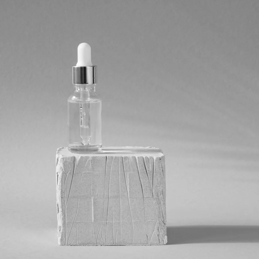 A skincare serum bottle, softened behind the headline figure