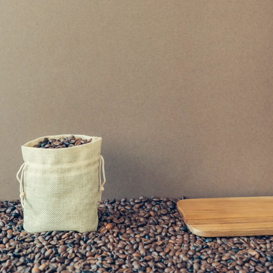 A sack of roasted coffee beans, softened behind the headline figure